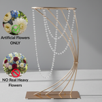 Load image into Gallery viewer, Decorative metal stand with artificial flowers on a gray background
