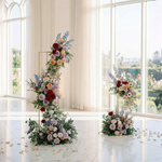 Load image into Gallery viewer, Floral arrangements in a room with large windows
