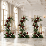 Load image into Gallery viewer, Three floral arches in a grand room with chandeliers and large windows.
