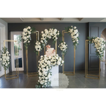 Load image into Gallery viewer, Decorative floral arches with white flowers in a room setting, featuring 'Bridal &amp; Present' branding.
