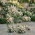 Load image into Gallery viewer, Decorative floral arrangements on stands in a garden setting
