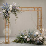 Load image into Gallery viewer, Decorative floral arch with a wooden frame against a plain wall.
