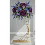 Load image into Gallery viewer, Bouquet of purple and blue flowers on a gold stand against a gray background
