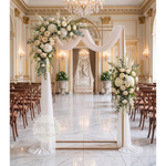 Load image into Gallery viewer, Decorative arch with flowers in a grand hall with chandeliers and chairs.
