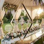 Load image into Gallery viewer, Decorative setup with flowers, chandelier, and mirror at a wedding venue.
