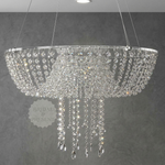Load image into Gallery viewer, Crystal chandelier hanging against a gray wall with 'Bridal &amp; Presents' logo.

