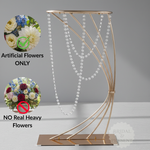 Load image into Gallery viewer, Decorative metal stand with artificial flower display on a gray background
