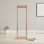 Load image into Gallery viewer, Gold-framed mirror on a light wooden floor with a neutral wall background
