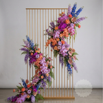 Load image into Gallery viewer, Colorful floral arrangement against a gold metal screen with 'Bridal Present' branding.
