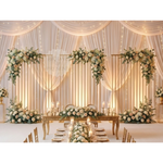 Load image into Gallery viewer, Decorated wedding reception table with floral arrangements and candles in a elegant setting.
