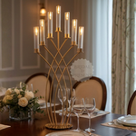 Load image into Gallery viewer, Decorative candelabra with candles on a table set for a meal in a formal dining room.
