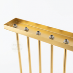 Load image into Gallery viewer, Gold metal console table with threaded connectors on a white background
