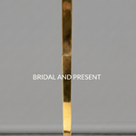 Load image into Gallery viewer, Gold clutch bag with 'Bridal and Present' branding on a gray background
