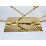 Load image into Gallery viewer, Gold clutch bag with geometric design on a white background
