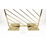 Load image into Gallery viewer, Gold decorative stand with geometric design on a white background, featuring 'Bridal &amp; Present' branding.
