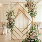Load image into Gallery viewer, Decorative gold geometric frame with floral arrangements in a wedding setting.
