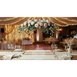 Load image into Gallery viewer, Decorative floral arrangement on a table with a wedding theme, set against a festive indoor background.
