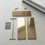 Load image into Gallery viewer, Gold door handles and hardware components on a gray surface

