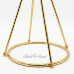 Load image into Gallery viewer, Gold decorative stand with 'Bridal &amp; Present' branding on a white background

