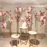 Load image into Gallery viewer, Gold square pedestal stands for baby shower, bridal shower, birthday parties, events, and parties. Inspired by wedding centerpiece ideas, DIY wedding centerpieces for round tables by using our tall gold centerpieces, flower column stands and boho wedding centerpieces.
